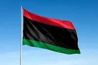 Waving Pan-African flag, national symbol, blue sky