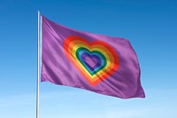 Waving rainbow heart flag, national symbol, blue sky