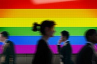 Rainbow flag led screen, silhouette people, LGBTQ pride