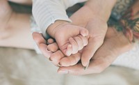 Closeup of family hands holding each other with love