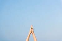 Praying hands pointed towards the sky, yoga excercise and stretching concept