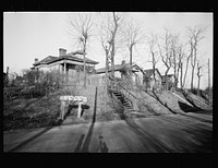 Cheap partly-constructed houses lacking water and sewage, Lockland, Ohio. Sourced from the Library of Congress.