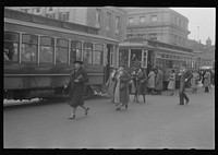 Washington, D.C. A street scene in front of the United States Bureau of Engraving, showing workers boarding street cars on 14th Street. Sourced from the Library of Congress.