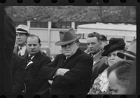 Shenandoah, Pennsylvania? John L. Lewis, center, at the stadium on the occasion of a district(?) meeting of the mine workers, seen among a crowd of people. Sourced from the Library of Congress.
