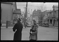 Shenandoah(?), Pennsylvania. Two women on a street corner, near a Protestant church, on Sunday morning. Sourced from the Library of Congress.