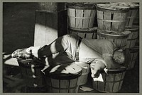 Man sleeping in fish market. Baltimore, Maryland. Sourced from the Library of Congress.