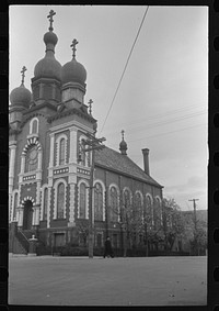[Untitled photo, possibly related to Mount Carmel, Pennsylvania. A brick church building with white stone trimming, towers, and a triple cross]. Sourced from the Library of Congress.