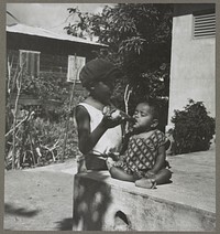 Black milk. This baby is getting a mixture of coffee, sugar and water instead of milk, which is too expensive. San Juan, Puerto Rico. Sourced from the Library of Congress.