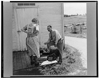 Silver salesman who travels from farm to farm trying to sell his wares to farm women. Near Lincoln, Vermont. Sourced from the Library of Congress.