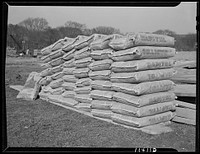 Washington, D.C. Construction of temporary war emergency buildings on the Mall, near 16th and 17th Streets, N.W. Stock of cement in bags. Sourced from the Library of Congress.