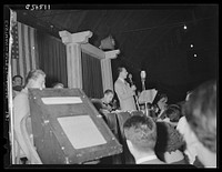 Washington, D.C. Vocalist and orchestra at the Uline Arena. Sourced from the Library of Congress.