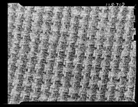 Texture background for motion picture and filmstrip titles. Wool fabric tweed detail. Sourced from the Library of Congress.