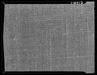 Texture background for motion picture and filmstrip titles. Cotton fabric. Sourced from the Library of Congress.