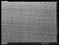 Texture background for motion picture and filmstrip titles. Chair caning. Sourced from the Library of Congress.