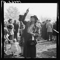  woman watching the Queen of the Cherry Blossom Festival being crowned. Washington, D.C.. Sourced from the Library of Congress.