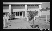 Backyard view of community building. Adobe construction. Chandler tract, Arizona. Sourced from the Library of Congress.