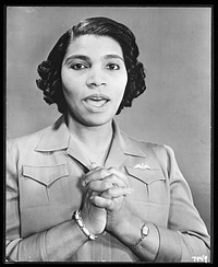 [Untitled photo shows: Marian Anderson, opera singer, singing with hands clasped and wearing a pin in the shape of the Royal Canadian Air Force pilot's wing pin badge]. Sourced from the Library of Congress.