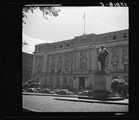 [Untitled photo, possibly related to: Washington, D.C. Workmen from a monument cleaning company cleaning Shepherd's statue at 14th and E Street, N.W.]. Sourced from the Library of Congress.