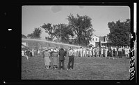 Firemen's muster. Boothbay center, Maine. Volunteer fire companies compete for one hundred dollars to the company which can throw water farthest with hand-operated pumps. Sourced from the Library of Congress.