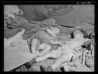 Birdsboro (vicinity), Berks County, Pennsylvania. Edward and Doris Glass taking their afternoon nap in the hayloft on the farm of FSA (Farm Security Administration) client Dallas E. Glass. Sourced from the Library of Congress.