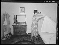 Lancaster County, Pennsylvania. Mrs. Royer making Martha Royer's bed on the Enos Royer farm. Sourced from the Library of Congress.