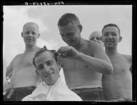 Camp Shelby, Hattiesburg, Mississippi. Getting a haircut. Sourced from the Library of Congress.