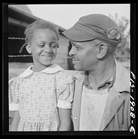 [Untitled photo, possibly related to: Newport News, Virginia.  shipyard worker and one of his daughters]. Sourced from the Library of Congress.