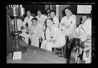 [Untitled photo, possibly related to: U.S. Naval Academy, Annapolis, Maryland. Studying a testing device]. Sourced from the Library of Congress.