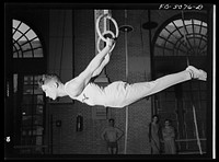 U.S. Naval Academy, Annapolis, Maryland. Gymnast on the flying rings. Sourced from the Library of Congress.