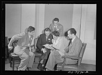 Washington, D.C. Foreign students at the international student sssembly recording short talks in their native language to be broadcast by shortwave, after censorship by the Office of War Information (OWI), to Nazi-held territory. An Italian group discussing the wording of their speeches. Sourced from the Library of Congress.
