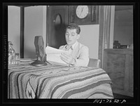 Washington, D.C. Lucky Baum, who spoke in French at the international student assembly, reading a short talk at the Deptartment of Interior radio studios. Lucky said he had worked for a French newspaper as a photographer. Sourced from the Library of Congress.