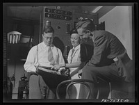 Washington, D.C. Foreign students at the International student assembly recording short talks in their native language, to be broadcast by shortwave after censorship by the Office of War Information (OWI) to Nazi-held territory. Filla, a Norwegian, was interested in the method used in recording. Sourced from the Library of Congress.