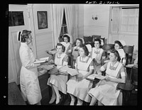Rochester, New York. Shirley Babcock at right in the front listening to a lecture with other student nurses. Sourced from the Library of Congress.