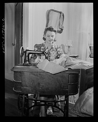 Rochester, New York. Shirley Babcock is very handy at the sewing machine and she helps her mother with the family sewing. Sourced from the Library of Congress.