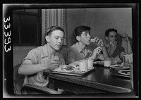 Keysville, Virginia. Randolph Henry High School. Cafeteria. Students don't have much money so they bring produce from farms for which they receive tickets. Lunches cost about fifteen cents. Typical lunch for fifteen cents: candied yams, macaroni and cheese, fruit salad, deviled eggs, dessert and milk. Milk is free and children can have as much as they want. Sourced from the Library of Congress.