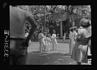 Charlotte Court House, Virginia. Central High School band every month or so marches up Main Street to give drills and concerts. Players must buy instruments and costumes and pay for their own lessons. Lessons are given during school hours. Sourced from the Library of Congress.