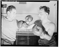 New York, New York. Maurice Case, boxing instructor, giving instructions to Joe Bruno (blind) at the Lighthouse, an institution for the blind, at 111 East Fifty-ninth Street. Sourced from the Library of Congress.