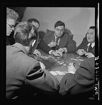 New York, New York. Playing cards (the participants are blind) at the Lighthouse, an institution for the blind, at 111 East Fifty-ninth Street. Note the tiny identification marks on the corners of the cards. Sourced from the Library of Congress.