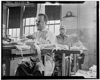 New York, New York. Blind men sewing mops by hand at the Lighthouse, an institution for the blind, at 111 East Fifty-ninth Street. Sourced from the Library of Congress.