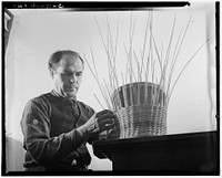 New York, New York. Alex Machginsky weaving a waste paper basket at the Lighthouse, an institution for the blind, at 111 East Fifty-ninth Street. Sourced from the Library of Congress.