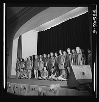 New York, New York. The girls of a singing and dancing class at Greenwich House who receive day care after school and on Saturdays while their mothers work, putting on a program for the entertainment of playmates and the nursery school group. Sourced from the Library of Congress.