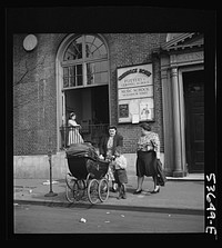 New York, New York. Two working mothers calling for children at Greenwich House, a neighborhood center, where they have left them early in the morning for day care. Sourced from the Library of Congress.