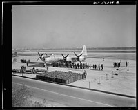 B-29 Super Fortress on display at Washington National Airport. Note fuel tanks in foreground which is necessary to fill fuel tanks--equivalent to railroad tank car. Sourced from the Library of Congress.