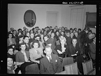 Washington, D.C. Audience at the showing of the S.S. Normandie film "A lady fights back" shown at the United Nations Club. Sourced from the Library of Congress.