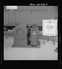 Laundry unit for small detachments. Weighing 2,465 pounds this airborne laundry unit will clean and dry 40 pounds of laundry per hour and will serve up to 600 men. Shown at demonstration of equipment held by United States Army Air Forces. Sourced from the Library of Congress.