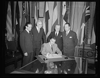 Washington, D.C. Joseph C. Grew, Undersecretary of State for the United States and foreign officials and representatives signing the declaration by United Nations and lend-lease agreements. Sourced from the Library of Congress.