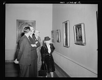 French journalists visit the National Gallery of Art, Washington, D.C., March 4, 1945. Left to right: Pierre Denoyer; Rene Batigne, Curator of the French Section at the Gallery who guided the guests on their tour; M. Jacques Rabut, Head of the French Construction Mission in Washington; and Mme. Andree Viollis. Sourced from the Library of Congress.