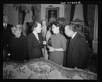 Mrs. James Clarke (wife of Office of War Information official and expert on the Balkans), Madame P.W.Kuo, Mr. Carson Chang at a reception celebrating International Women's Day at the home of Joseph E. Davies, former United States Ambassador to the Union of Soviet Socialist Republics. Sourced from the Library of Congress.