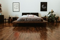 Industrial bedroom with dark wooden floors