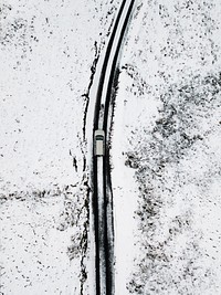 Drone shot of a snowy route of Newlands Pass at the Lake District, England